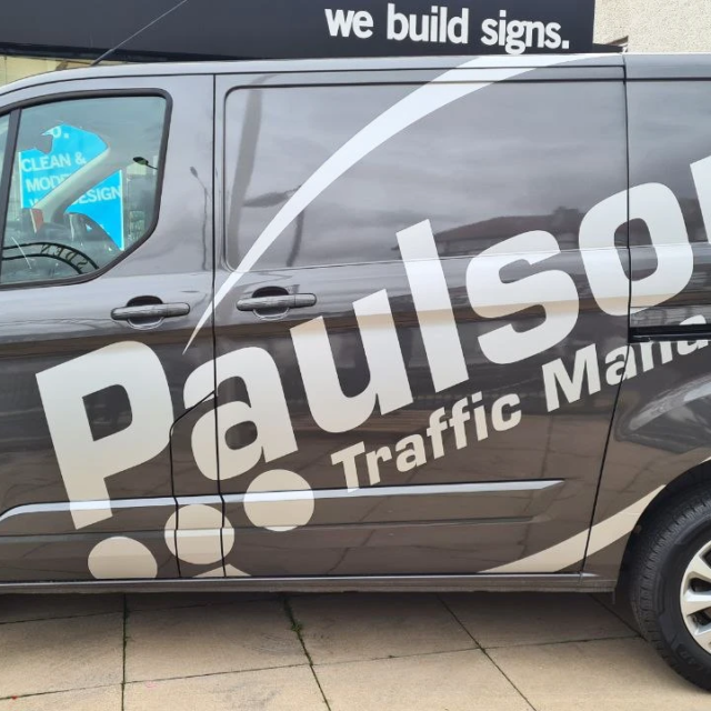 paulsons large logo sign to side of van
