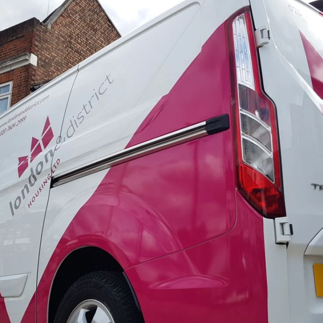 london district pink and white van signage