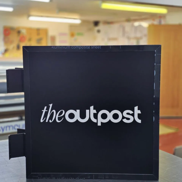 the outpost retail projecting sign