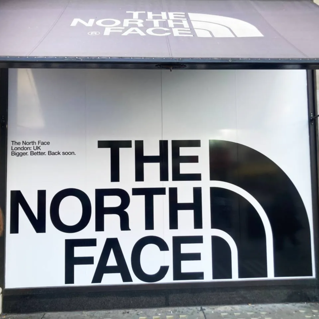 the north face shop has moved window graphics