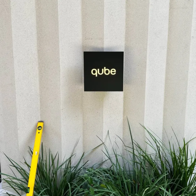 qube apartments exterior signage