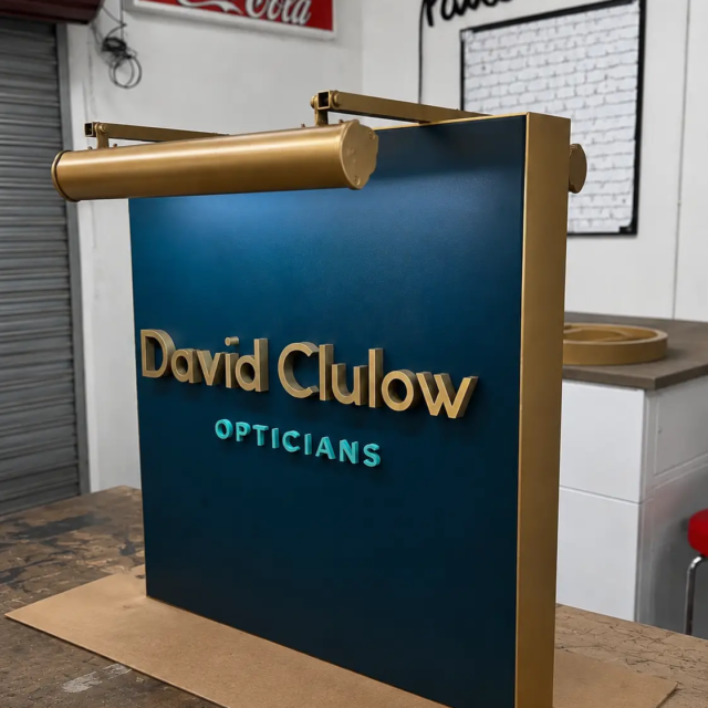 bespke-light-up-projecting-signs david clulow opticians projecting sign with light