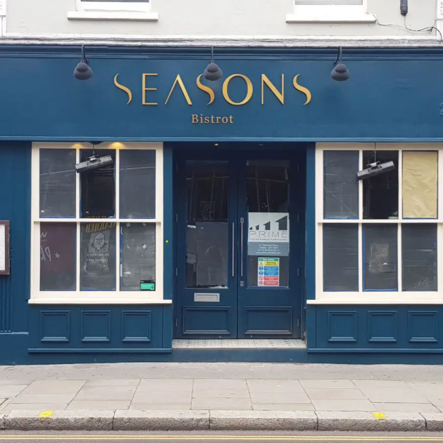 seasons bistrot signage in gold lettering on blue