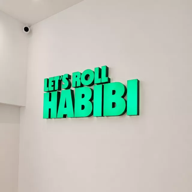 illuminated-green-lettering illuminated green lettering lets roll habibi restaurant
