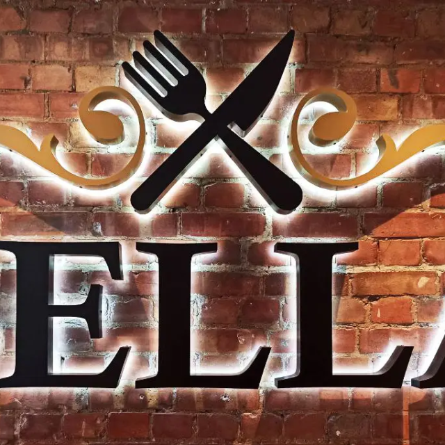 bella italia pasta restaurant sign on brick