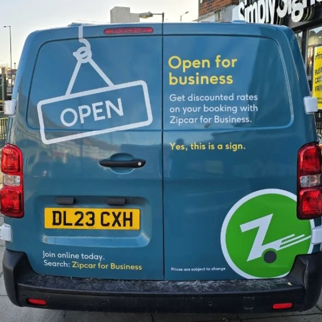 zipcar rear view company branding van sign